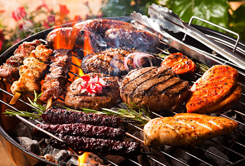 getty_rm_photo_of_assorted_meats_cooking_on_grill